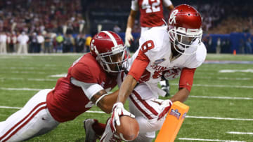 NEW ORLEANS, LA - JANUARY 02: Jalen Saunders #8 of the Oklahoma Sooners scores a touchdown over Ha Ha Clinton-Dix #6 of the Alabama Crimson Tide during the Allstate Sugar Bowl at the Mercedes-Benz Superdome on January 2, 2014 in New Orleans, Louisiana. (Photo by Streeter Lecka/Getty Images)