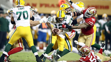 SANTA CLARA, CALIFORNIA - NOVEMBER 24: Quarterback Aaron Rodgers #12 of the Green Bay Packers is sacked by defensive end Nick Bosa #97 of the San Francisco 49ers during the 1st half of the game at Levi's Stadium on November 24, 2019 in Santa Clara, California. (Photo by Ezra Shaw/Getty Images)