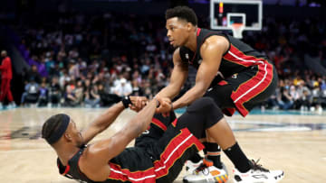 Kyle Lowry #7 of the Miami Heat helps up Jimmy Butler #22 of the Miami Heat(Photo by David Jensen/Getty Images)