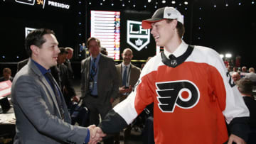 NASHVILLE, TENNESSEE - JUNE 29: Carson Bjarnason shakes hands with general manager Daniel Briere after being selected 51st overall by the Philadelphia Flyers during the 2023 Upper Deck NHL Draft - Rounds 2-7 at Bridgestone Arena on June 29, 2023 in Nashville, Tennessee. (Photo by Jeff Vinnick/NHLI via Getty Images)