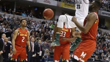 Mar 12, 2016; Indianapolis, IN, USA; Michigan State Spartans forward Deyonta Davis (23) dunks against Maryland Terrapins forward Robert Carter (4) during the Big Ten Conference tournament at Bankers Life Fieldhouse. Mandatory Credit: Brian Spurlock-USA TODAY Sports
