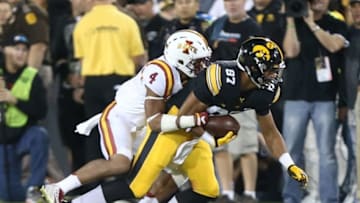 Sep 10, 2016; Iowa City, IA, USA; Iowa Hawkeyes tight end Noah Fant (87) is tackled by Iowa State Cyclones defensive back Evrett Edwards (4) at Kinnick Stadium. The Hawkeyes beat the Cyclones 42-3. Mandatory Credit: Reese Strickland-USA TODAY Sports