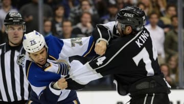 Mar 5, 2013; Los Angeles, CA, USA; Los Angeles Kings center Dwight King (74) and St. Louis Blues right wing Ryan Reaves (75) fight in the first period at the Staples Center. Mandatory Credit: Jayne Kamin-Oncea-USA TODAY Sports