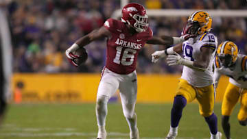 2022 NFL mock draft; Arkansas Razorbacks wide receiver Treylon Burks (16) runs the ball against LSU Tigers linebacker Mike Jones Jr. (19) in the second half at Tiger Stadium. Mandatory Credit: Kirby Lee-USA TODAY Sports