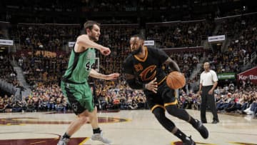 CLEVELAND, OH - DECEMBER 29: LeBron James #23 of the Cleveland Cavaliers drives to the basket against Tyler Zeller #44 of the Boston Celtics during a game on December 29, 2016 at Quicken Loans Arena in Cleveland, Ohio. NOTE TO USER: User expressly acknowledges and agrees that, by downloading and/or using this photograph, user is consenting to the terms and conditions of the Getty Images License Agreement. Mandatory Copyright Notice: Copyright 2016 NBAE (Photo by David Liam Kyle/NBAE via Getty Images)