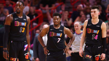 Bam Adebayo #13, Kyle Lowry #7 and Tyler Herro #14 of the Miami Heat look on against the Minnesota Timberwolves(Photo by Michael Reaves/Getty Images)