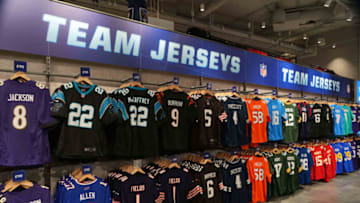 Oct 9, 2021; London, England, United Kingdom; The jerseys of Lamar Jackson (Baltimore Ravens), Christian McCaffrey (Carolina Panthers), Josh Allen (Buffalo Bills), Justin Fields (Chicago Bears), Joe Burrow (Cincinnati Bengals), Baker Mayfield (Cleveland Browns), Dak Prescott (Dallas Cowboys, Von Miller (Denver Broncos), Jared Goff (Detroit Lions), Aaron Rodgers and Davante Adams (Green Bay Packers), Brandin Cooks (Houston Texans), Trevor Lawrence (Jacksonville Jaguars), Jonathan Taylor (Indianapolis Colts), Derek Carr (Las Vegas Raiders), Aaron Donald (Los Angeles Rams), Patrick Mahomes (Kansas City Chiefs) and Justin Herbert (Los Angeles Chargers) are seen at Tottenham Hogspur Stadium. Mandatory Credit: Kirby Lee-USA TODAY Sports