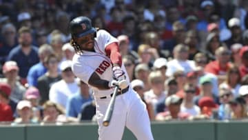 Jul 3, 2016; Boston, MA, USA; Boston Red Sox first baseman Hanley Ramirez (13) hits an RBI double during the fifth inning against the Los Angeles Angels at Fenway Park. Mandatory Credit: Bob DeChiara-USA TODAY Sports