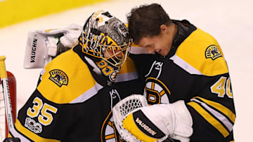 BOSTON - OCTOBER 26: Boston Bruins' goalie Anton Khudobin, left, is congratulated by goalie Tuuka Rask at the end of the game in which the Bruins won, 2-1. The Boston Bruins host the San Jose Sharks in a regular season NHL hockey game at TD Garden in Boston on Oct. 26, 2017. (Photo by John Tlumacki/The Boston Globe via Getty Images)