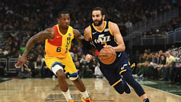 MILWAUKEE, WISCONSIN - JANUARY 07: Ricky Rubio #3 of the Utah Jazz drives around Eric Bledsoe #6 of the Milwaukee Bucks during the first half of a game at Fiserv Forum on January 07, 2019 in Milwaukee, Wisconsin. (Photo by Stacy Revere/Getty Images)