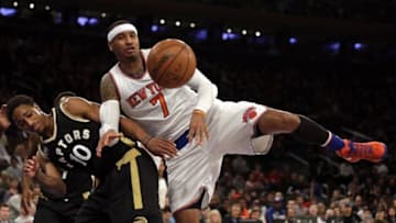 Apr 10, 2016; New York, NY, USA; New York Knicks forward Carmelo Anthony (7) and Toronto Raptors guard DeMar DeRozan (10) battle for a rebound during the second half at Madison Square Garden. The Raptors defeated the Knicks 93-89. Mandatory Credit: Adam Hunger-USA TODAY Sports