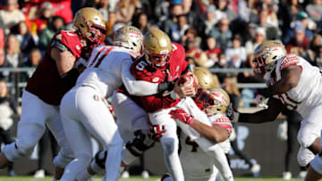 Nov 20, 2021; Chestnut Hill, Massachusetts, USA; Boston College Eagles quarterback Phil Jurkovec (5) is sacked by Florida State Seminoles defensive end Jermaine Johnson II (11) and defensive end Keir Thomas (4) during the first half at Alumni Stadium. Mandatory Credit: Winslow Townson-USA TODAY Sports