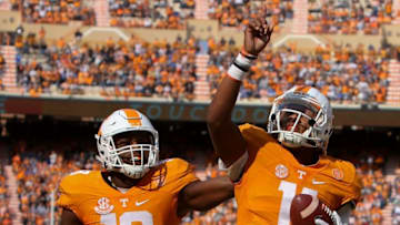 Nov 12, 2016; Knoxville, TN, USA; Tennessee Volunteers tight end Jason Croom (18) congratulates Tennessee Volunteers quarterback Joshua Dobbs (11) after Hobbs scored a touchdown against the Kentucky Wildcats during the first half at Neyland Stadium. Mandatory Credit: Randy Sartin-USA TODAY Sports