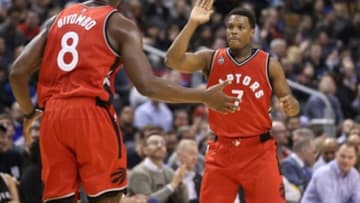 Feb 24, 2016; Toronto, Ontario, CAN; Toronto Raptors point guard Kyle Lowry (7) celebrates with center Bismack Biyombo (8) after scoring against the Minnesota Timberwolves at Air Canada Centre. The Raptors beat the Timberwolves 114-105. Mandatory Credit: Tom Szczerbowski-USA TODAY Sports