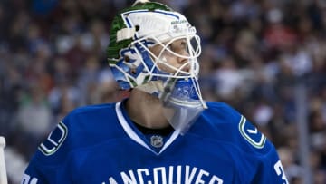 VANCOUVER, CANADA - JANUARY 7: Eddie Lack #31 of the Vancouver Canucks watches the replay against the Pittsburgh Penguins on January 7, 2014 at Rogers Arena in Vancouver, British Columbia, Canada. (Photo by Marissa Baecker/Getty Images)
