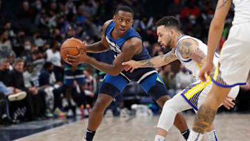 Jan 16, 2022; Minneapolis, Minnesota, USA; Minnesota Timberwolves guard McKinley Wright IV (25) works around Golden State Warriors guard Chris Chiozza (2) in the fourth quarter at Target Center. Mandatory Credit: Bruce Kluckhohn-USA TODAY Sports