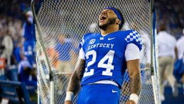 Oct 2, 2021; Lexington, Kentucky, USA; Kentucky Wildcats running back Chris Rodriguez Jr. (24) celebrates after linebacker Trevin Wallace (32) runs in a blocked field goal for a touchdown during the third quarter against the Florida Gators at Kroger Field. Mandatory Credit: Jordan Prather-USA TODAY Sports