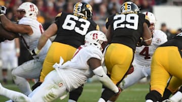 Jan 1, 2016; Pasadena, CA, USA; Stanford Cardinal defensive end Aziz Shittu (7) defends against Iowa Hawkeyes running back LeShun Daniels Jr. (29) during the third quarter in the 2016 Rose Bowl at Rose Bowl. Mandatory Credit: Robert Hanashiro-USA TODAY Sports