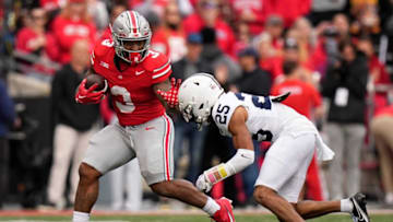 Oct 21, 2023; Columbus, Ohio, USA; Ohio State Buckeyes running back Miyan Williams (3) runs past Penn State Nittany Lions running back DK Kency (25) during the NCAA football game at Ohio Stadium.