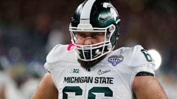 ARLINGTON, TX - DECEMBER 31: Jack Allen #66 of the Michigan State Spartans warms up prior to the Goodyear Cotton Bowl against the Alabama Crimson Tide at AT&T Stadium on December 31, 2015 in Arlington, Texas. (Photo by Scott Halleran/Getty Images)