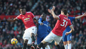 MANCHESTER, ENGLAND - FEBRUARY 25: Paul Pogba of Manchester United in action with Ngolo Kante of Chelsea during the Premier League match between Manchester United and Chelsea at Old Trafford on February 25, 2018 in Manchester, England. (Photo by John Peters/Man Utd via Getty Images)