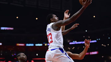 LOS ANGELES, CA - JANUARY 22: Lou Williams #23 of the LA Clippers scores past Andrew Wiggins #22 of the Minnesota Timberwolves during a 126-118 Timberwolves win at Staples Center on January 22, 2018 in Los Angeles, California. (Photo by Harry How/Getty Images)