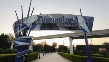 ANAHEIM, CALIFORNIA - SEPTEMBER 30: A Disneyland sign is posted at an empty entrance to Disneyland on September 30, 2020 in Anaheim, California. Disney is laying off 28,000 workers amid the toll of the COVID-19 pandemic on theme parks. (Photo by Mario Tama/Getty Images)