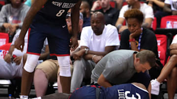 Jul 11, 2022; Las Vegas, NV, USA; New Orleans Pelicans forward E.J. Liddell (32) suffers an apparent injury during an NBA Summer League game against the Atlanta Hawks at Cox Pavilion. Mandatory Credit: Stephen R. Sylvanie-USA TODAY Sports