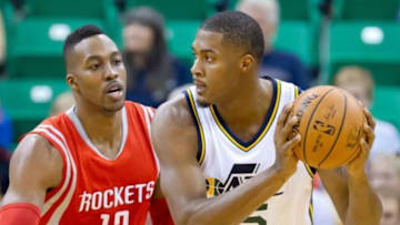 Oct 29, 2014; Salt Lake City, UT, USA; Houston Rockets center Dwight Howard (12) defends against Utah Jazz center Derrick Favors (15) during the first quarter at EnergySolutions Arena. Mandatory Credit: Russ Isabella-USA TODAY Sports