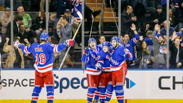 NEW YORK, NY - MARCH 14: Rangers players celebrate goal with fans during the Pittsburgh Penguins and New York Rangers NHL game on March 14, 2018, at Madison Square Garden in New York, NY. (Photo by John Crouch/Icon Sportswire via Getty Images)