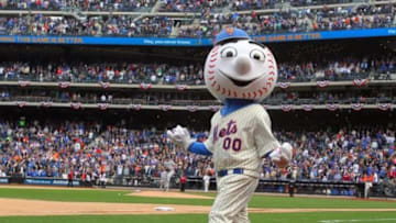 Apr 1, 2013; New York, NY, USA; Mr. Met tosses t-shirts into the stands during the seventh inning stretch of a MLB opening day game between the New York Mets and the San Diego Padres at Citi Field. Mandatory Credit: Brad Penner-USA TODAY Sports