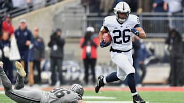 COLUMBUS, OH - OCTOBER 28: Saquon Barkley #26 of the Penn State Nittany Lions leaps over kicker Sean Nuernberger #96 of the Ohio State Buckeyes en route to a 97-yard opening kick off return for a touchdown in the first quarter at Ohio Stadium on October 28, 2017 in Columbus, Ohio. (Photo by Jamie Sabau/Getty Images)