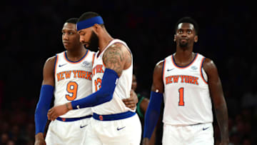 NEW YORK, NEW YORK - OCTOBER 26: Bobby Portis #1 looks on as RJ Barrett #9 hugs Marcus Morris Sr. #13 of the New York Knicks during the first half of their game against the Boston Celtics at Madison Square Garden on October 26, 2019 in New York City. NOTE TO USER: User expressly acknowledges and agrees that, by downloading and or using this photograph, User is consenting to the terms and conditions of the Getty Images License Agreement. (Photo by Emilee Chinn/Getty Images)
