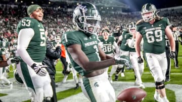EAST LANSING, MICHIGAN - OCTOBER 15: Jayden Reed #1 of the Michigan State Spartans reacts after making the game-winning reception against the Wisconsin Badgers in double overtime at Spartan Stadium on October 15, 2022 in East Lansing, Michigan. (Photo by Nic Antaya/Getty Images)
