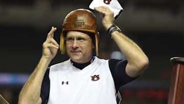 Sep 5, 2015; Atlanta, GA, USA; Auburn Tigers head coach Gus Malzahn wears the old leather helmet after defeating the Louisville Cardinals in the 2015 Chick-fil-A Kickoff Game at the Georgia Dome. Auburn won 31-24. Mandatory Credit: Shanna Lockwood-USA TODAY Sports