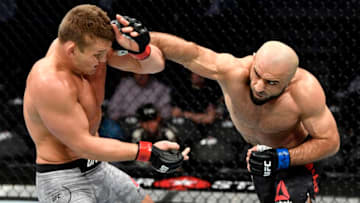 LAS VEGAS, NEVADA - DECEMBER 14: (R-L) Omari Akhmedov of Russia strikes Ian Heinisch in their middleweight bout during the UFC 245 event at T-Mobile Arena on December 14, 2019 in Las Vegas, Nevada. (Photo by Jeff Bottari/Zuffa LLC)