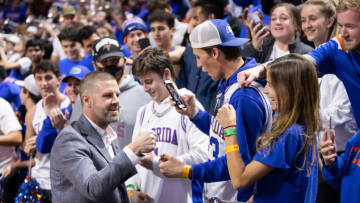 Jan 5, 2022; Gainesville, Florida, USA; Florida Gators football head coach Billy Napier meets with the student section during halftime between the Florida Gators and the Alabama Crimson Tide at Billy Donovan Court at Exactech Arena. Mandatory Credit: Matt Pendleton-USA TODAY Sports