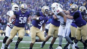 Nov 27, 2015; Seattle, WA, USA; Washington Huskies fullback Myles Gaskin (9) rushes into the end zone for a touchdown against the Washington State Cougars during the second quarter at Husky Stadium. Mandatory Credit: Jennifer Buchanan-USA TODAY Sports