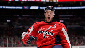 WASHINGTON, DC - DECEMBER 11: John Carlson #74 of the Washington Capitals celebrates after scoring a goal in the third period against the Boston Bruins at Capital One Arena on December 11, 2019 in Washington, DC. (Photo by Patrick McDermott/NHLI via Getty Images)
