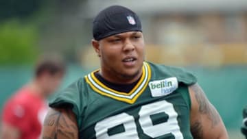 Jun 11, 2013; Green Bay, WI, USA; Green Bay Packers defensive end Jerel Worthy works out during organized team activities at Clarke Hinkle Field in Green Bay. Mandatory Credit: Benny Sieu-USA TODAY Sports