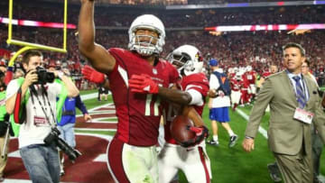 Jan 16, 2016; Glendale, AZ, USA; Arizona Cardinals wide receiver Larry Fitzgerald (11) celebrates with teammates after scoring the winning touchdown against the Green Bay Packers during overtime in a NFC Divisional round playoff game at University of Phoenix Stadium. Mandatory Credit: Mark J. Rebilas-USA TODAY Sports