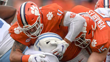 Clemson defensive lineman Bryan Bresee(11) and linebacker Jake Venables(15) tackle The Citadel sophomore Emeka Nwanze(32) during the second quarter of the game Saturday, Sept. 19, 2020 at Memorial Stadium in Clemson, S.C.Clemson The Citadel Ncaa Football