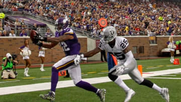 Aug 22, 2015; Minneapolis, MN, USA; Minnesota Vikings wide receiver Charles Johnson (12) catches a pass past Oakland Raiders cornerback D.J. Hayden (25) for a touchdown in the second quarter at TCF Bank Stadium. Mandatory Credit: Bruce Kluckhohn-USA TODAY Sports