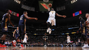 DENVER, CO - APRIL 7: Emmanuel Mudiay #0 of the Denver Nuggets goes up for a dunk against the New Orleans Pelicans on April 7, 2017 at the Pepsi Center in Denver, Colorado. NOTE TO USER: User expressly acknowledges and agrees that, by downloading and/or using this Photograph, user is consenting to the terms and conditions of the Getty Images License Agreement. Mandatory Copyright Notice: Copyright 2017 NBAE (Photo by Garrett Ellwood/NBAE via Getty Images)