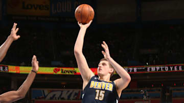 OKLAHOMA CITY, OK - MARCH 30: Nikola Jokic #15 of the Denver Nuggets shoots the ball against the Oklahoma City Thunder on March 30, 2018 at Chesapeake Energy Arena in Oklahoma City, Oklahoma. NOTE TO USER: User expressly acknowledges and agrees that, by downloading and/or using this photograph, user is consenting to the terms and conditions of the Getty Images License Agreement. Mandatory Copyright Notice: Copyright 2018 NBAE (Photo by Layne Murdoch/NBAE via Getty Images)Getty ID: 940296864