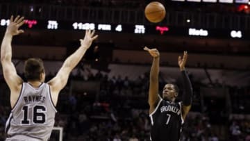 Nov 22, 2014; San Antonio, TX, USA; Brooklyn Nets small forward Joe Johnson (7) shoots the ball over San Antonio Spurs power forward Aron Baynes (16) during the second half at AT&T Center. Mandatory Credit: Soobum Im-USA TODAY Sports