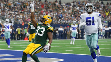ARLINGTON, TEXAS - OCTOBER 06: Aaron Jones #33 of the Green Bay Packers scores against the Dallas Cowboys in the first quarter against the Green Bay Packers at AT&T Stadium on October 06, 2019 in Arlington, Texas. (Photo by Richard Rodriguez/Getty Images)