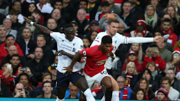 MANCHESTER, ENGLAND - OCTOBER 20: Marcus Rashford of Manchester United in action with Sadio Mane and Jordan Henderson of Liverpool FC during the Premier League match between Manchester United and Liverpool FC at Old Trafford on October 20, 2019 in Manchester, United Kingdom. (Photo by Matthew Peters/Manchester United via Getty Images)