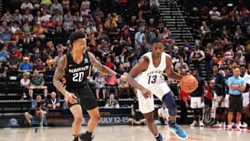 SALT LAKE CITY - JULY 2: Jaren Jackson Jr. #13 of the handles the ball against Jason Collins #20 of the Atlanta Hawks during the 2018 Summer League at the Vivint Smart Home Arena on July 2, 2018 in Salt Lake CIty, Utah. NOTE TO USER: User expressly acknowledges and agrees that, by downloading and or using this photograph, User is consenting to the terms and conditions of the Getty Images License Agreement. Mandatory Copyright Notice: Copyright 2018 NBAE (Photo by Joe Murphy/NBAE via Getty Images)