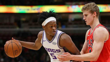 CHICAGO, IL - DECEMBER 01: De'Aaron Fox #5 of the Sacramento Kings looks to pass against Lauri Markkanen #24 of the Chicago Bulls at the United Center on December 1, 2017 in Chicago, Illinois. The Kings defeated the Bulls 107-106. NOTE TO USER: User expressly acknowledges and agrees that, by downloading and or using this photograph, User is consenting to the terms and conditions of the Getty Images License Agreement. (Photo by Jonathan Daniel/Getty Images)